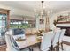 Inviting dining room with fireplace, seamlessly blending classic design and modern style at 3724 Fawn Grove Ct, Land O Lakes, FL 34639