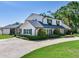 Charming two-story home featuring a well-manicured lawn and mature landscaping at 3724 Fawn Grove Ct, Land O Lakes, FL 34639