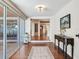 Foyer with hardwood floors, decorative rug, and a view to the rest of the home at 3724 Fawn Grove Ct, Land O Lakes, FL 34639