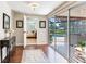 Spacious hall leading to bedroom with access to the sunroom and beautiful backyard at 3724 Fawn Grove Ct, Land O Lakes, FL 34639