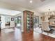 Well-lit hallway connecting living spaces, with hardwood floors and pool views at 3724 Fawn Grove Ct, Land O Lakes, FL 34639