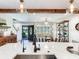 Kitchen with a large island, pendant lighting and open sightlines to the front entry of the home at 3724 Fawn Grove Ct, Land O Lakes, FL 34639