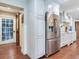 Kitchen featuring stainless steel refrigerator and white cabinetry at 3724 Fawn Grove Ct, Land O Lakes, FL 34639