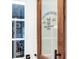 Door to the laundry room featuring decorative vinyl lettering at 3724 Fawn Grove Ct, Land O Lakes, FL 34639