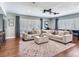 Spacious living room filled with natural light, plush seating, and stylish decor perfect for relaxation and entertainment at 3724 Fawn Grove Ct, Land O Lakes, FL 34639