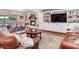 Spacious living room features a brick fireplace, built-in shelving and ample seating, great for entertaining at 3724 Fawn Grove Ct, Land O Lakes, FL 34639