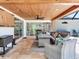 Outdoor patio area features comfortable seating, a wood ceiling, and plenty of room for activities at 3724 Fawn Grove Ct, Land O Lakes, FL 34639