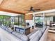 Covered outdoor patio offering a blend of relaxation and entertainment, complemented by a wood ceiling at 3724 Fawn Grove Ct, Land O Lakes, FL 34639