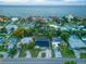 An aerial view showcasing the property among a residential neighborhood near a waterfront at 3947 Overlook Ne Dr, St Petersburg, FL 33703