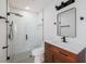 Modern bathroom featuring a sleek vanity, matte black fixtures, and a stylish walk-in shower with subway tile at 3947 Overlook Ne Dr, St Petersburg, FL 33703