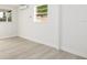 Bright bedroom features neutral walls, light flooring and modern mini-split air conditioning unit at 3947 Overlook Ne Dr, St Petersburg, FL 33703