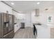 Contemporary kitchen featuring stainless steel appliances, white cabinetry, and sleek design at 3947 Overlook Ne Dr, St Petersburg, FL 33703