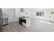 Bright, airy kitchen with stainless steel appliances and adjacent breakfast bar at 3947 Overlook Ne Dr, St Petersburg, FL 33703