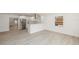 Bright, open-concept living area flows into a modern kitchen with stainless steel appliances at 3947 Overlook Ne Dr, St Petersburg, FL 33703