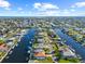 Aerial view of waterfront homes along canals in Hernando Beach with boat docks and scenic views at 4137 Des Prez Ct, Hernando Beach, FL 34607