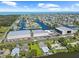 Stunning aerial view of a coastal community with waterfront homes, canal access, and a boat storage facility at 4137 Des Prez Ct, Hernando Beach, FL 34607