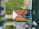 Aerial view of home with brown roof next to canal with boat dock at 4137 Des Prez Ct, Hernando Beach, FL 34607