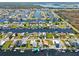 Aerial view featuring waterfront homes with canal access near boat storage and maintenance facilities at 4137 Des Prez Ct, Hernando Beach, FL 34607