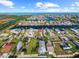 Aerial view of a residential neighborhood with canals and waterfront properties in Hernando Beach at 4137 Des Prez Ct, Hernando Beach, FL 34607