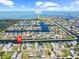 Aerial view of waterfront community with home marked on canal leading to the Gulf at 4137 Des Prez Ct, Hernando Beach, FL 34607