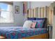 Comfortable bedroom featuring colorful decor and bright bedding at 4137 Des Prez Ct, Hernando Beach, FL 34607