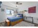 Cozy bedroom featuring colorful decor, bright bedding, and a ceiling fan at 4137 Des Prez Ct, Hernando Beach, FL 34607