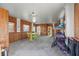 Large garage with storage, natural lighting, and space for a recreational area at 4137 Des Prez Ct, Hernando Beach, FL 34607