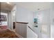 Well-lit hallway with hardwood floors and decorative accents, leading to various rooms at 4137 Des Prez Ct, Hernando Beach, FL 34607