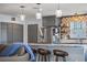 Modern kitchen area with stainless steel refrigerator and a stylish backsplash at 4137 Des Prez Ct, Hernando Beach, FL 34607