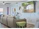 Cozy living room with comfortable seating and a large TV for entertainment at 4137 Des Prez Ct, Hernando Beach, FL 34607
