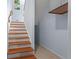 Stairwell with wood stairs and light-colored walls leading to the upper level at 4137 Des Prez Ct, Hernando Beach, FL 34607