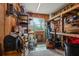 Organized workshop with various tools, shelving, and a window providing natural light at 4137 Des Prez Ct, Hernando Beach, FL 34607