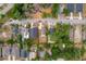 Aerial view of a home surrounded by a neatly maintained lawn and a boundary line for the property at 4218 E Cayuga St, Tampa, FL 33610