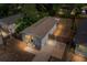 Aerial view of a single-Gathering home in the evening, highlighting its well-maintained exterior and curb appeal at 4218 E Cayuga St, Tampa, FL 33610