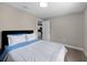 Bedroom view featuring a large window and comfortable bed with white covers at 4218 E Cayuga St, Tampa, FL 33610