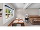 Cozy living room with a wooden dining table and view of the adjacent window at 4218 E Cayuga St, Tampa, FL 33610