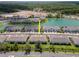 Community aerial view featuring townhouses and community lake at 4262 Cloud Hopper Way, Lutz, FL 33559