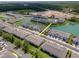 Community aerial view featuring townhouses and community lake with water features at 4262 Cloud Hopper Way, Lutz, FL 33559