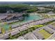 Aerial view of the townhome highlighting its proximity to the lake and surrounding neighborhood at 4262 Cloud Hopper Way, Lutz, FL 33559