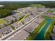 Modern townhomes in a lakeside community featuring manicured lawns and ample parking at 4262 Cloud Hopper Way, Lutz, FL 33559