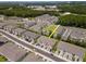 Community aerial view featuring townhouses with attached garages and shared community amenities at 4262 Cloud Hopper Way, Lutz, FL 33559