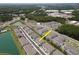 Scenic aerial view of townhomes with lush landscaping and community amenities at 4262 Cloud Hopper Way, Lutz, FL 33559