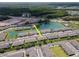 Aerial shot captures the townhome in a peaceful lakeside setting with well-kept grounds at 4262 Cloud Hopper Way, Lutz, FL 33559