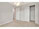 Large bedroom featuring neutral walls, carpet, modern lighting and convenient closet at 4262 Cloud Hopper Way, Lutz, FL 33559