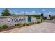 Elegant stone community entrance sign with lush landscaping welcomes you home at 4262 Cloud Hopper Way, Lutz, FL 33559
