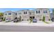Well-maintained townhomes with paver driveways and manicured landscaping at 4262 Cloud Hopper Way, Lutz, FL 33559