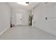 Clean, painted garage features a neutral epoxy floor and ample space for storage or parking at 4262 Cloud Hopper Way, Lutz, FL 33559