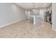 Open kitchen features modern finishes, stainless appliances, and tile flooring at 4262 Cloud Hopper Way, Lutz, FL 33559