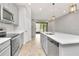 Modern kitchen with stainless steel appliances, bright countertops, and an inviting open layout at 4262 Cloud Hopper Way, Lutz, FL 33559