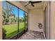 Relaxing screened patio overlooking a lush green yard with a beautiful garden view at 4262 Cloud Hopper Way, Lutz, FL 33559